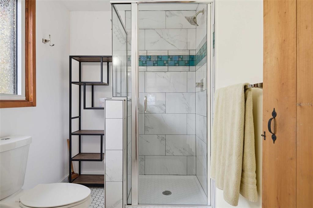 3490 Southeast 193rd Place Yankeetown, FL 34498 - Photo 31 of 71 a bathroom with a toilet and a shower