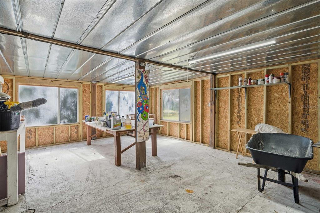 3490 Southeast 193rd Place Yankeetown, FL 34498 - Photo 44 of 71 a bedroom with furniture and a large window