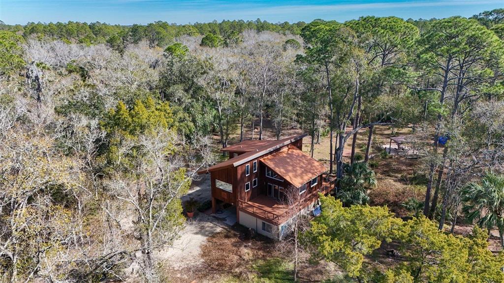 3490 Southeast 193rd Place Yankeetown, FL 34498 - Photo 46 of 71 an aerial view of a house with a yard