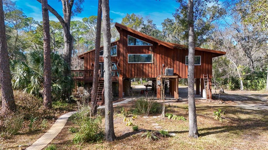 3490 Southeast 193rd Place Yankeetown, FL 34498 - Photo 54 of 71 a front view of a house with street view