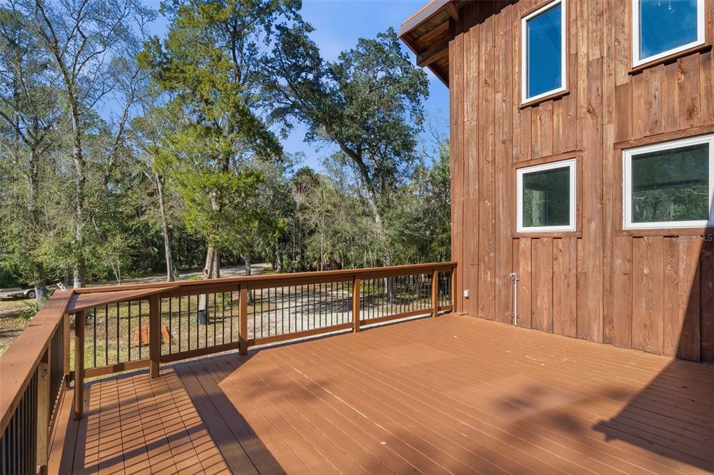 3490 Southeast 193rd Place Yankeetown, FL 34498 - Photo 8 of 71 a view of balcony with wooden floor and fence