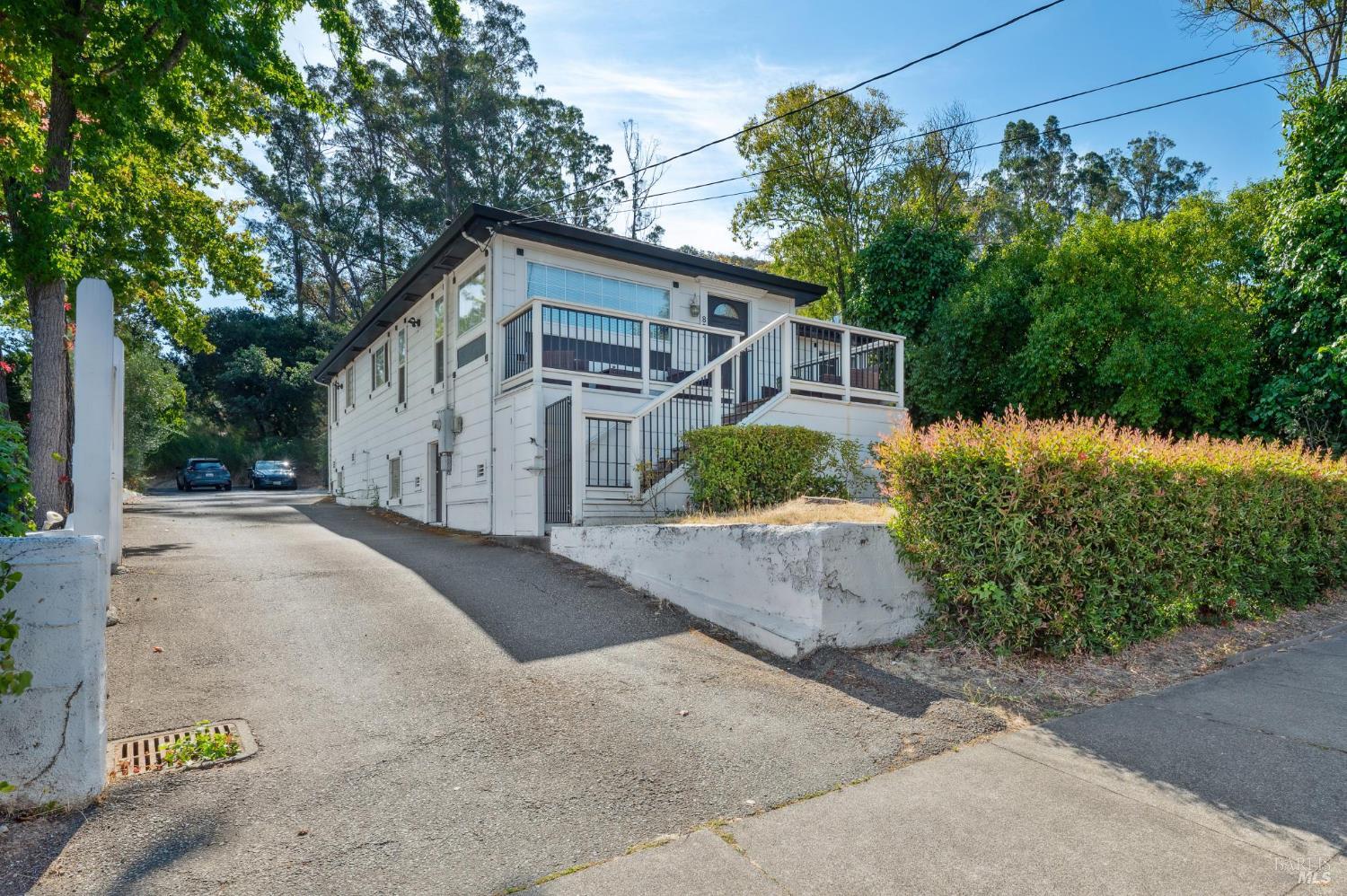 a view of a house with a street