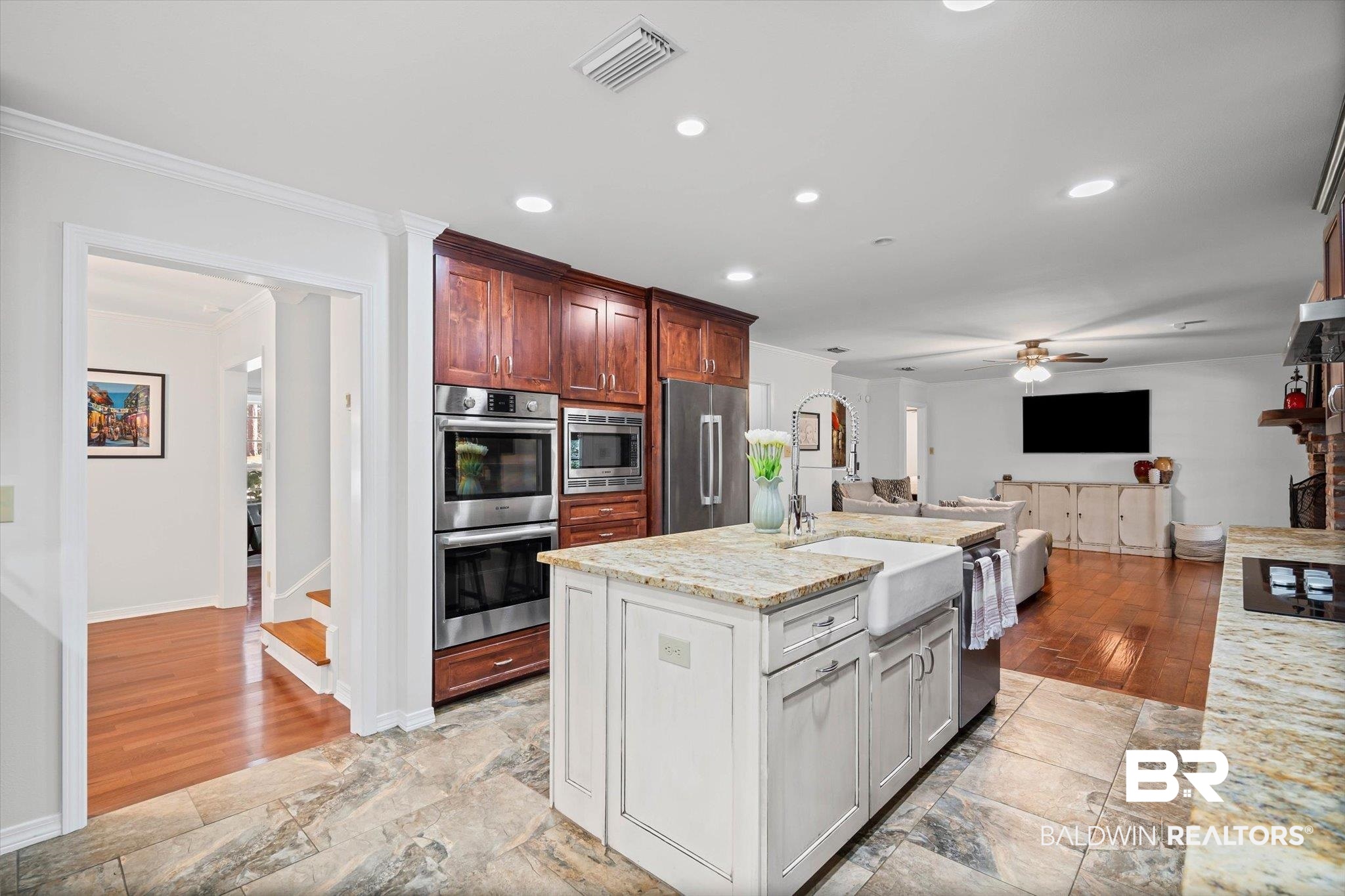 31369 Blakeley Way Daphne, AL 36527 - Photo 35 of 38 Kitchen featuring light stone counters, stainless steel appliances, recessed lighting, a kitchen island with sink, and open floor plan
