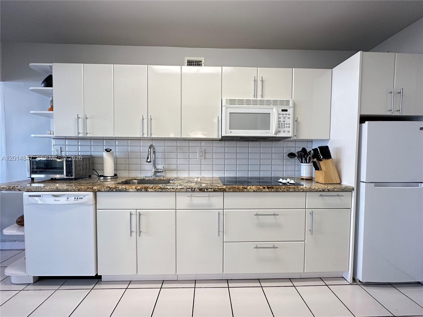 100 Lincoln Road, Unit 1012 Miami Beach, FL 33139 - Photo 2 of 19 renovated kitchen with granite countertops
