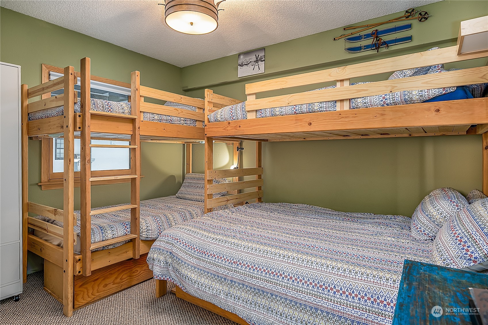 17800 Alpental Access Road, Unit 1114 Snoqualmie Pass, WA 98068 - Photo 11 of 21 a bedroom with a bed and a window