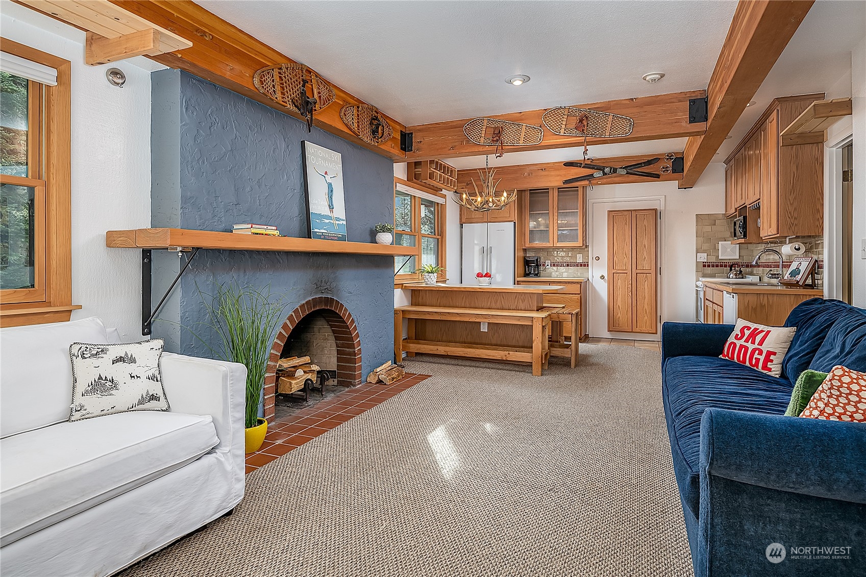 17800 Alpental Access Road, Unit 1114 Snoqualmie Pass, WA 98068 - Photo 5 of 21 a living room with furniture and a fireplace