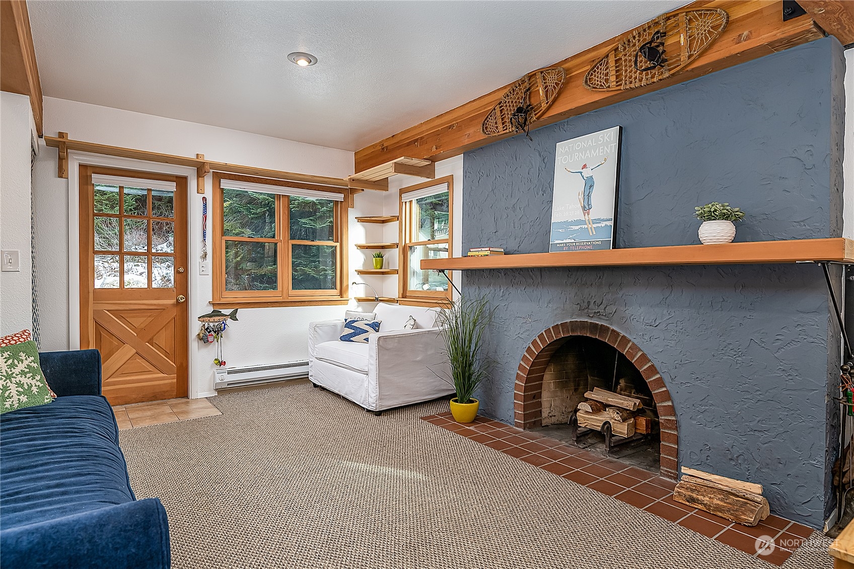 17800 Alpental Access Road, Unit 1114 Snoqualmie Pass, WA 98068 - Photo 6 of 21 a living room with furniture and a fireplace