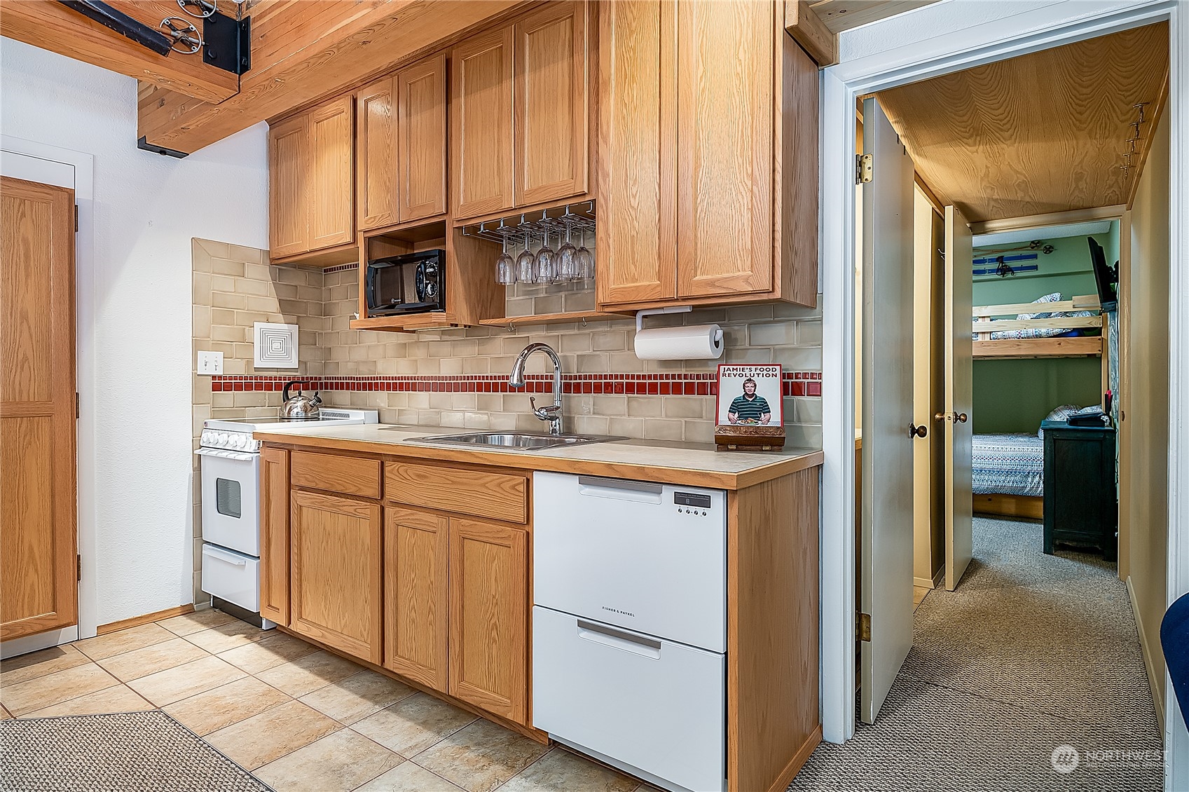 17800 Alpental Access Road, Unit 1114 Snoqualmie Pass, WA 98068 - Photo 10 of 21 a kitchen with stainless steel appliances granite countertop a sink and cabinets