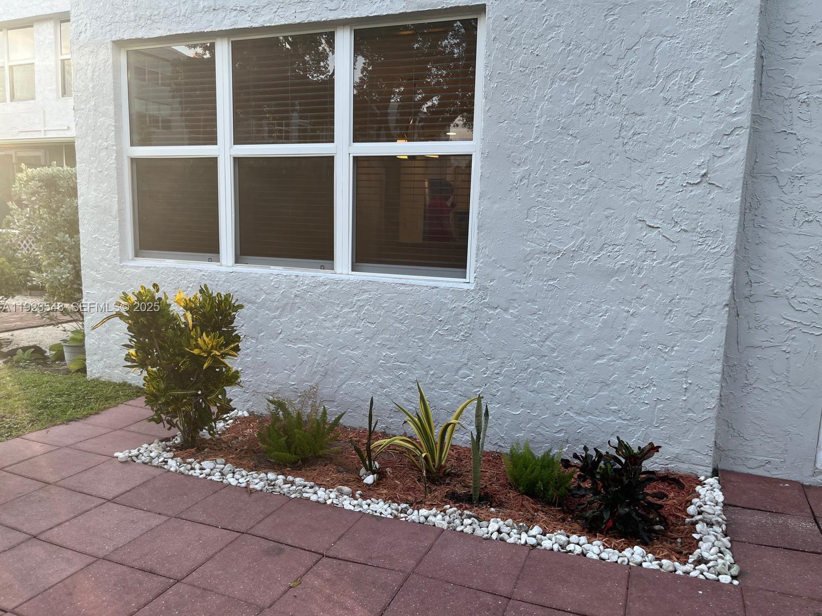 9421 Evergreen Place, Unit 107 Davie, FL 33324 - Photo 28 of 49 a vase of flowers sitting on a floor