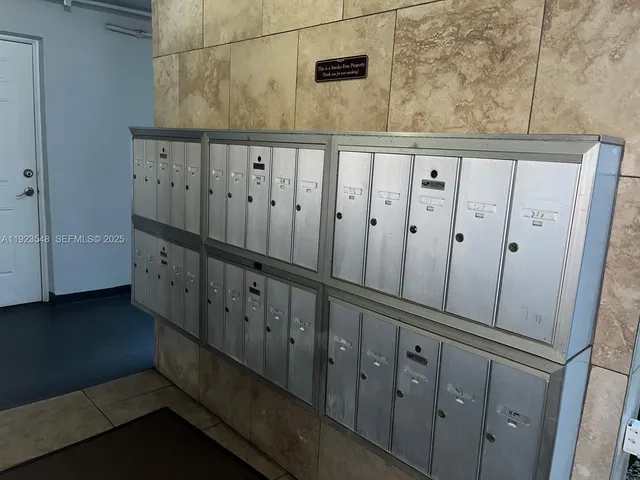 a front view of a residential apartment building with a yard