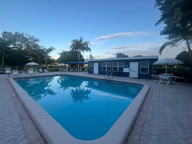 a view of a swimming pool with a sitting space