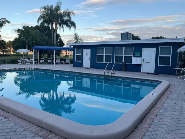 a view of a park with large trees