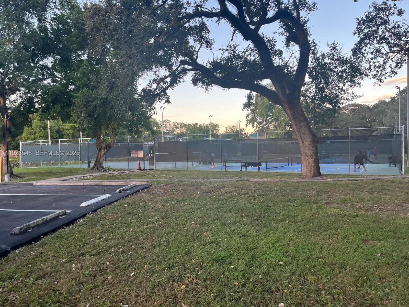 9421 Evergreen Place, Unit 107 Davie, FL 33324 - Photo 38 of 49 a view of outdoor space with deck and trees