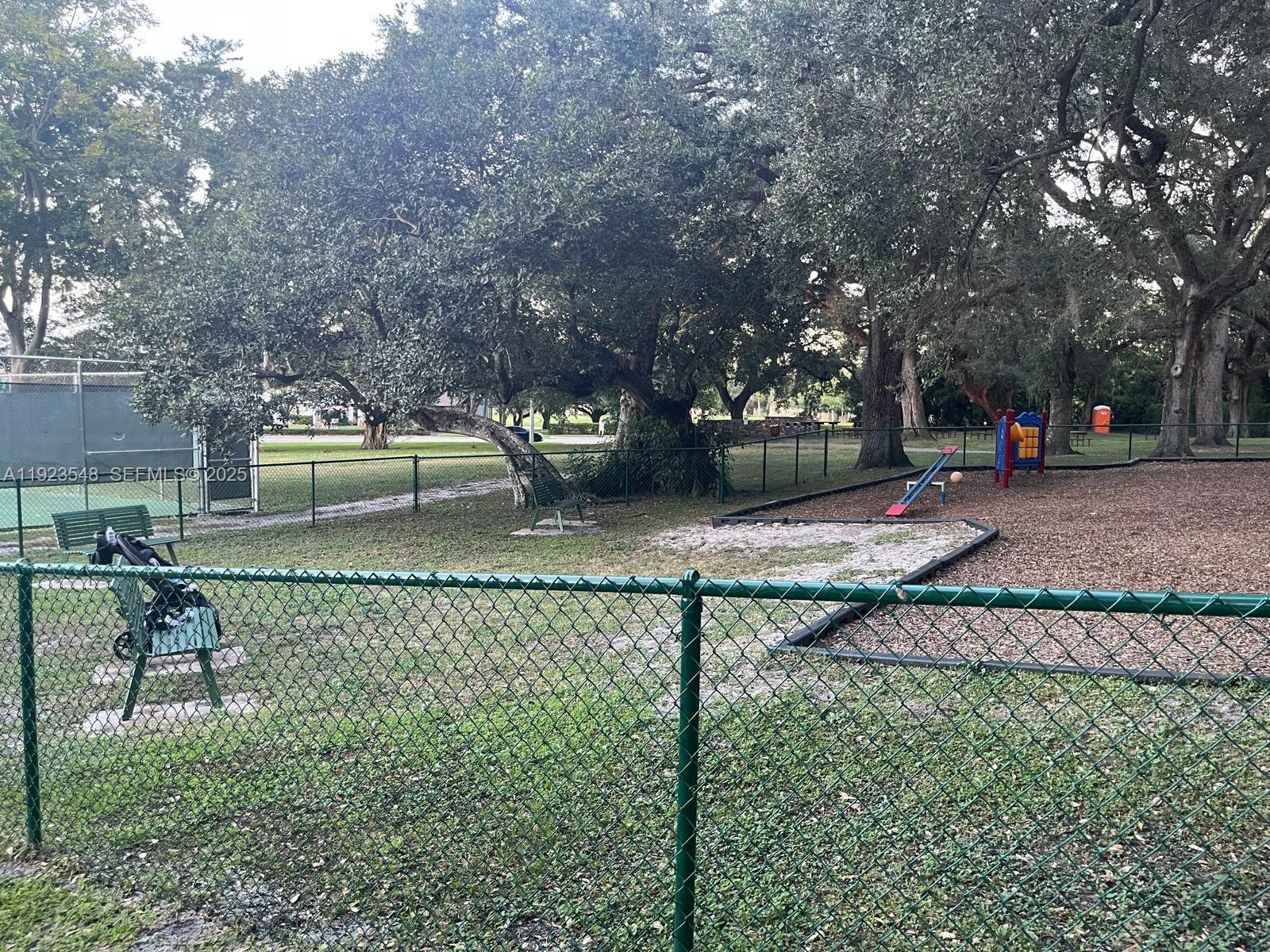 9421 Evergreen Place, Unit 107 Davie, FL 33324 - Photo 40 of 49 a view of a park with large trees