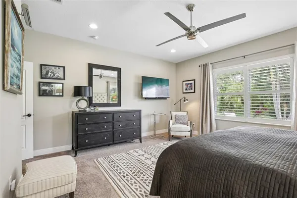 a bedroom with a bed and a dresser