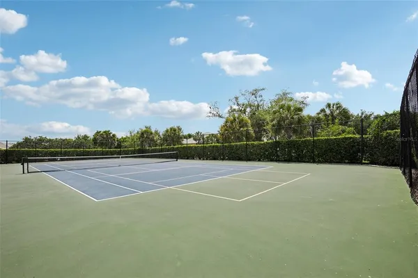 a view of an outdoor space and tennis court