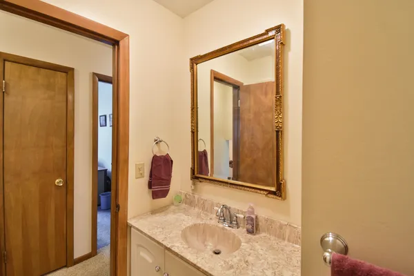 a bathroom with a shower and a sink