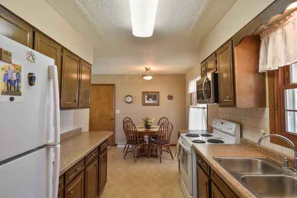 a kitchen with a stove and a microwave