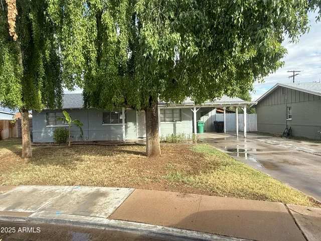front view of a house with a yard