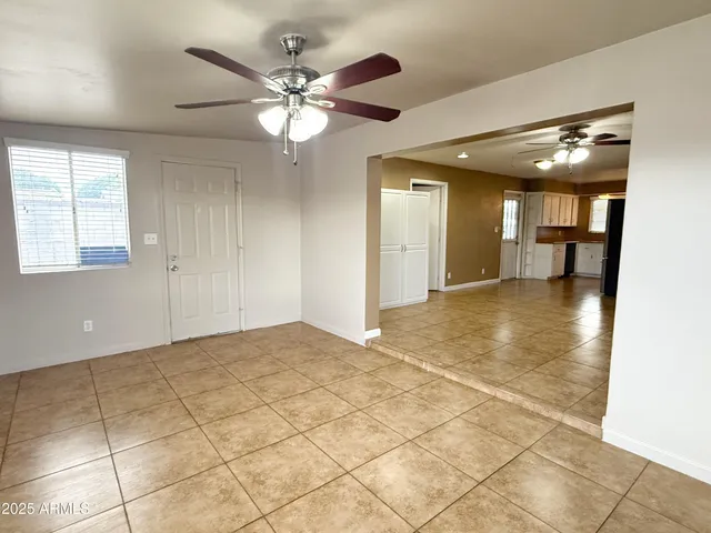a view of livingroom with hardwood floor and ceiling fan