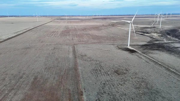 a view of a large body of water with a building in the background