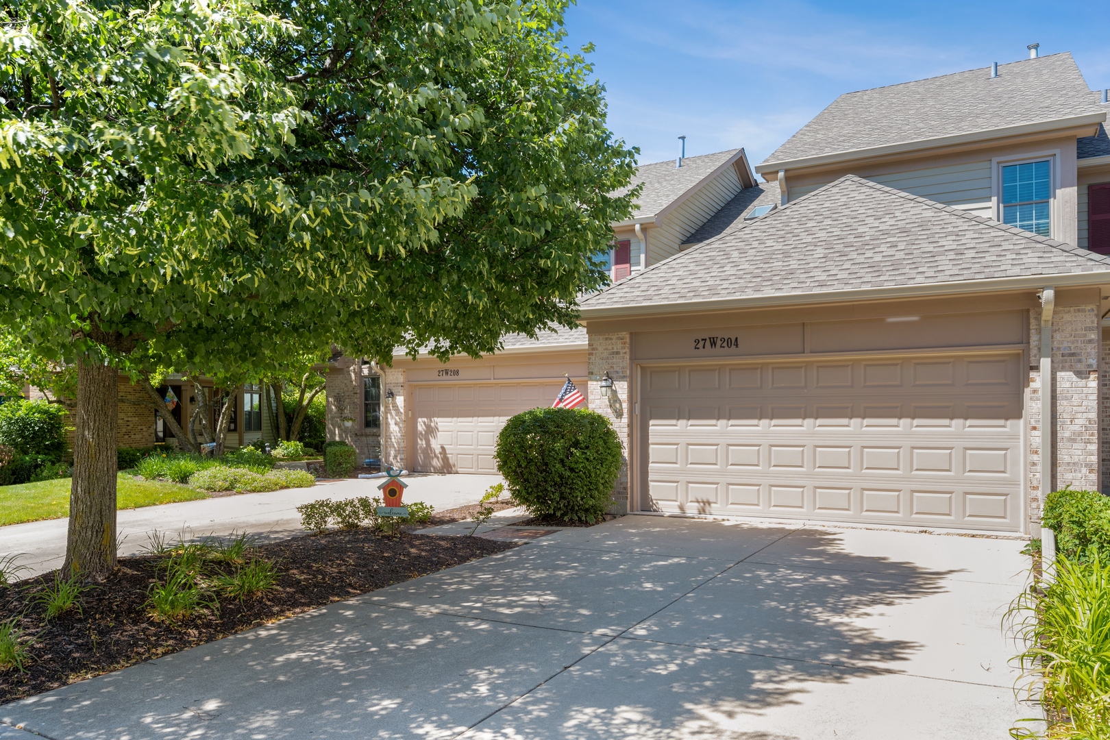 27W204 Chelsea Circle Winfield, IL 60190 - Photo 1 of 30 a front view of a house with a yard and garage