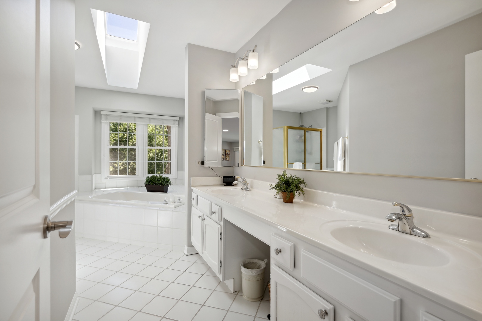 27W204 Chelsea Circle Winfield, IL 60190 - Photo 14 of 30 a spacious bathroom with a sink a large mirror and a shower