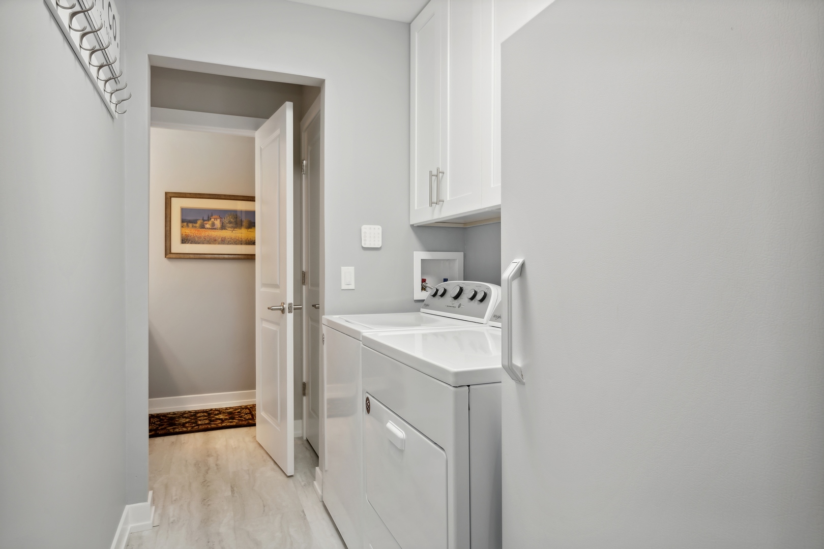 27W204 Chelsea Circle Winfield, IL 60190 - Photo 23 of 30 a view of a bathroom with a sink and washing machine