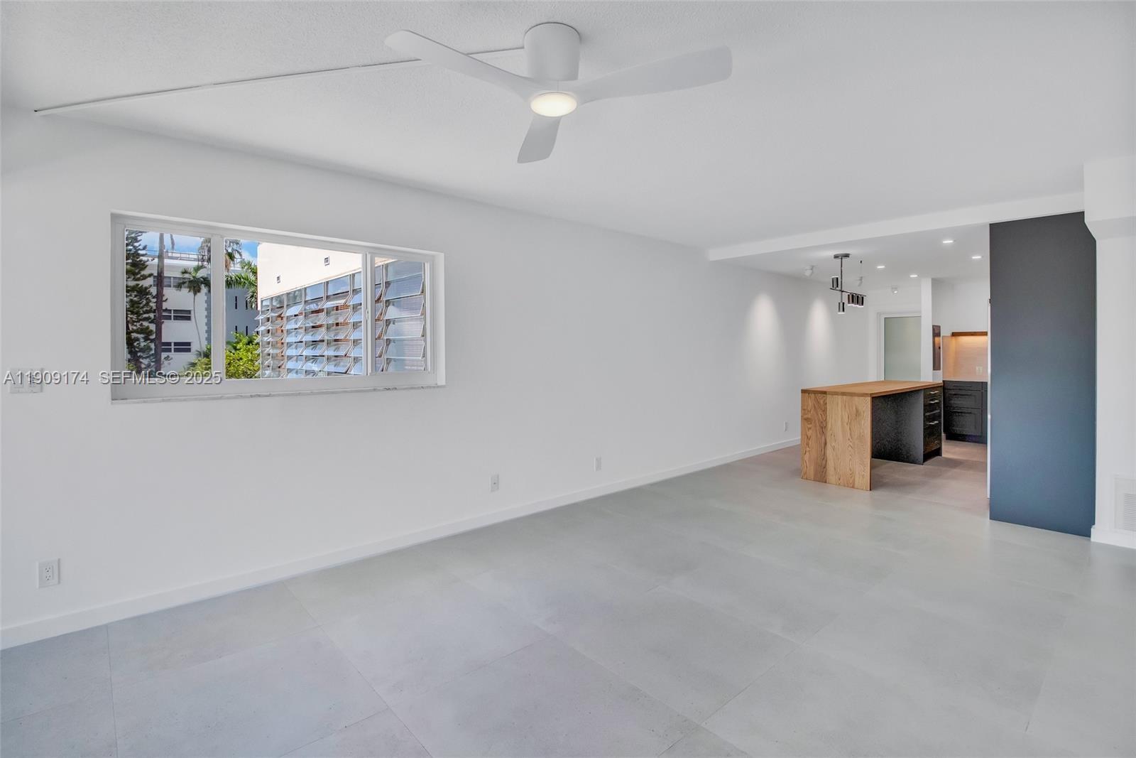 54 Isle Of Venice Drive, Unit 7 Fort Lauderdale, FL 33301 - Photo 11 of 41 an empty room with windows and entrance