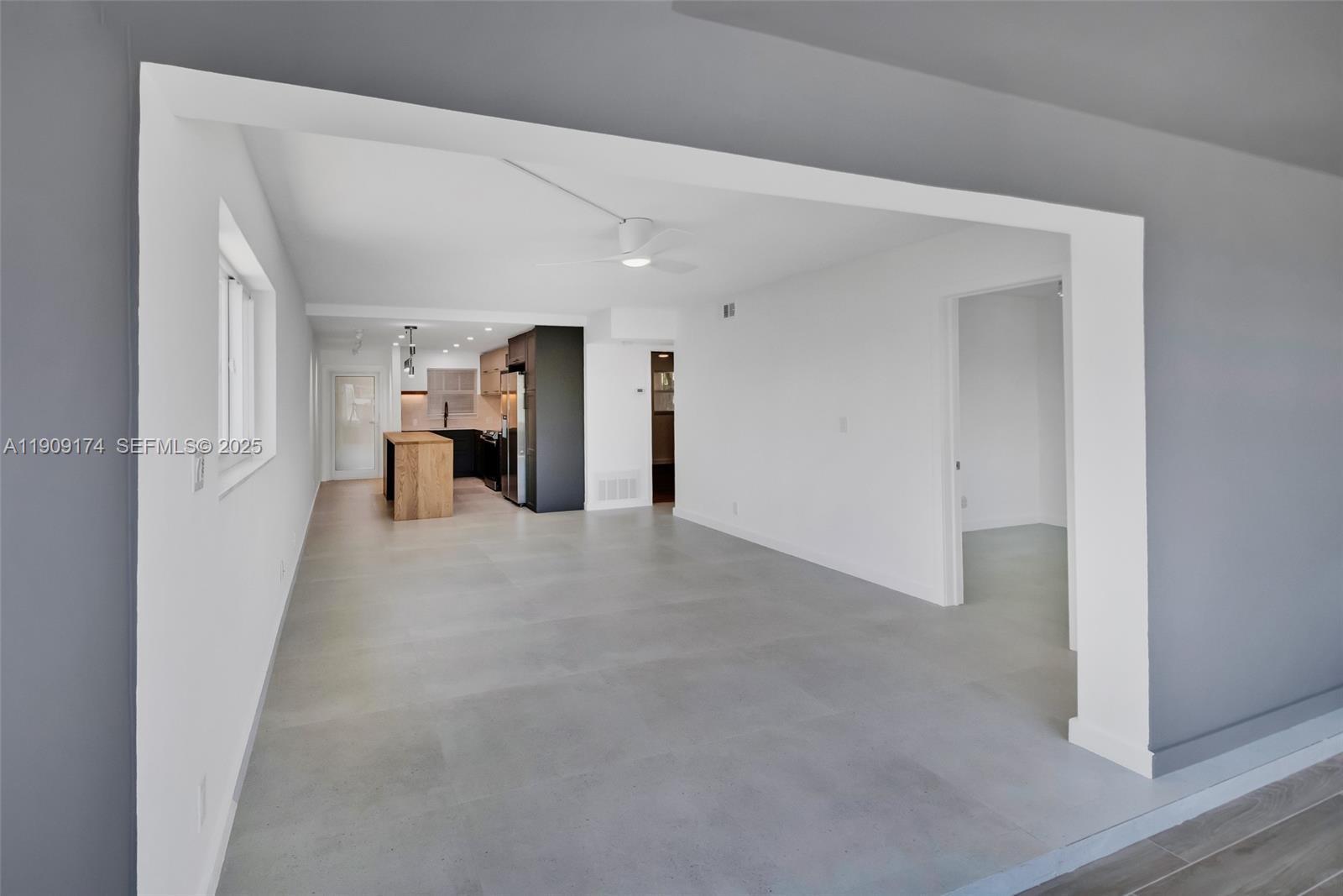 54 Isle Of Venice Drive, Unit 7 Fort Lauderdale, FL 33301 - Photo 16 of 41 a view of a big room with closet and windows