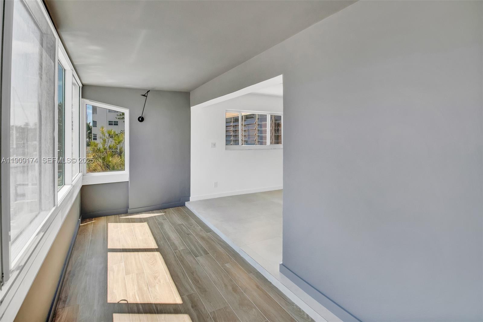 54 Isle Of Venice Drive, Unit 7 Fort Lauderdale, FL 33301 - Photo 17 of 41 a view of hallway with window