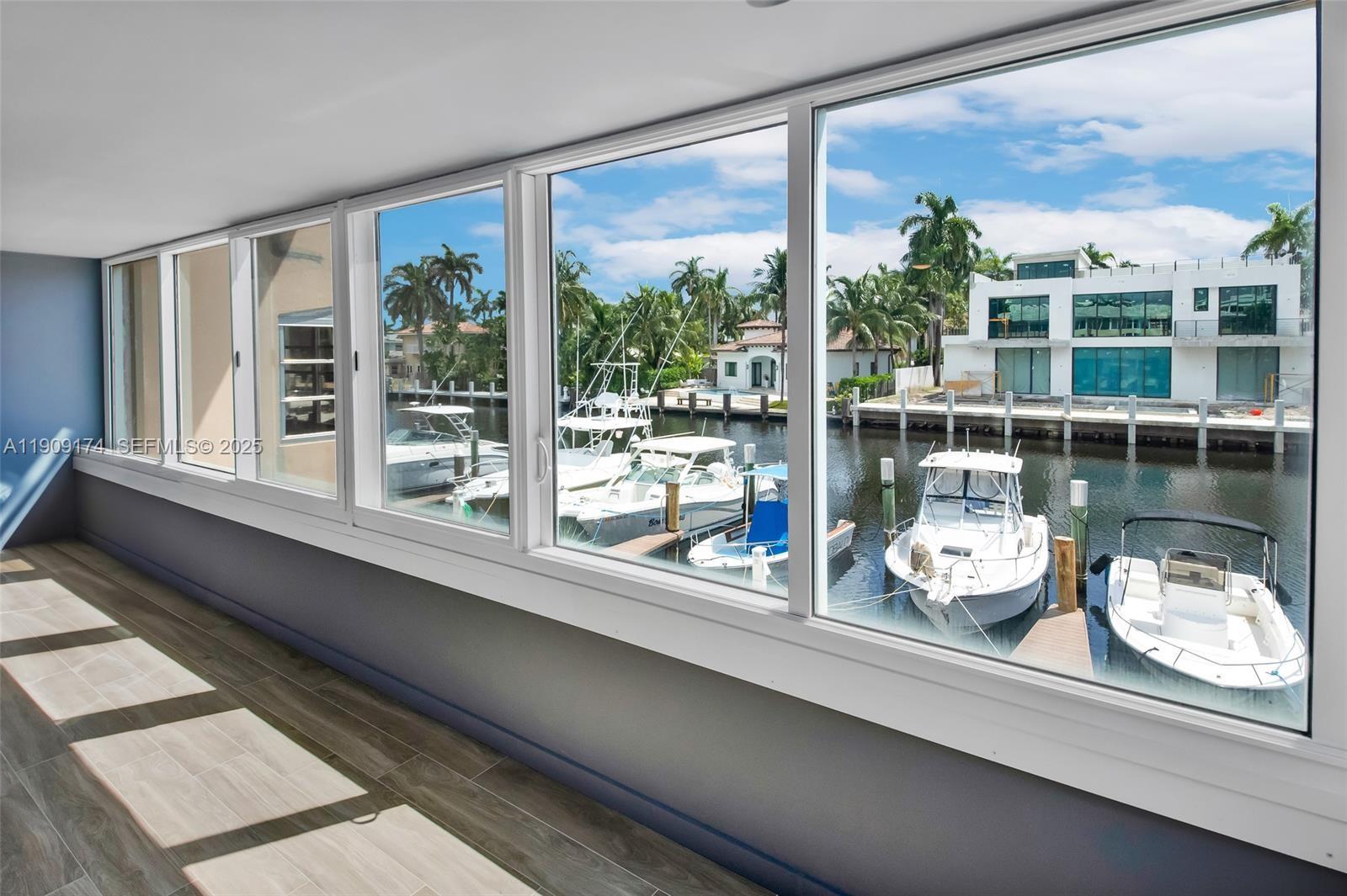 54 Isle Of Venice Drive, Unit 7 Fort Lauderdale, FL 33301 - Photo 20 of 41 a kitchen with a large window and a sink