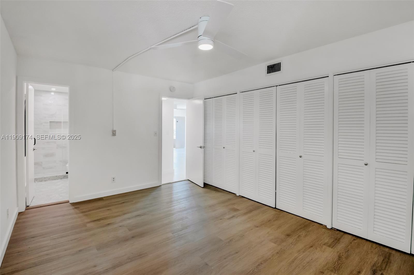 54 Isle Of Venice Drive, Unit 7 Fort Lauderdale, FL 33301 - Photo 25 of 41 a view of an empty room with wooden floor
