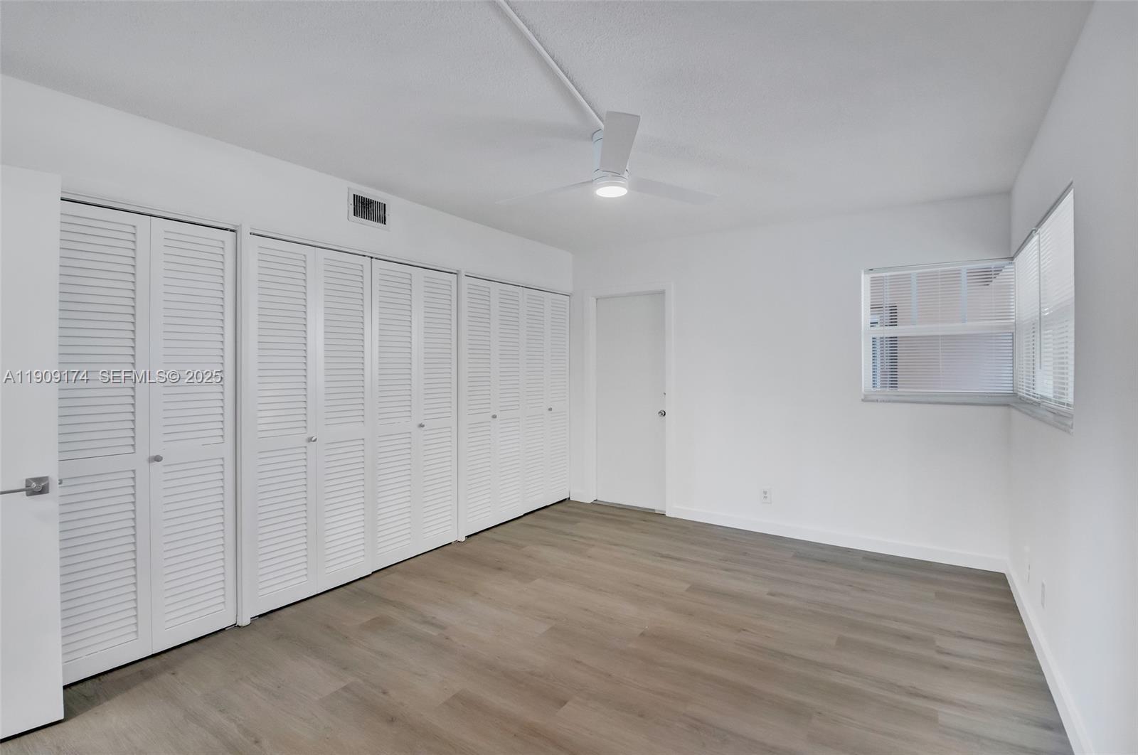 54 Isle Of Venice Drive, Unit 7 Fort Lauderdale, FL 33301 - Photo 26 of 41 wooden floor in an empty room