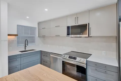 a view of a swimming pool with outdoor seating