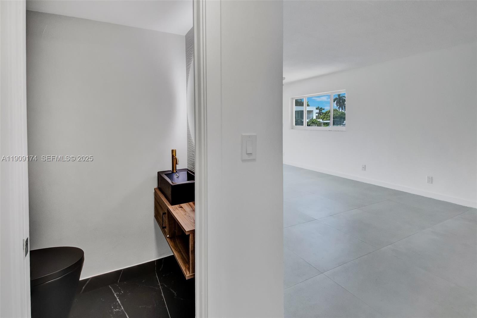 54 Isle Of Venice Drive, Unit 7 Fort Lauderdale, FL 33301 - Photo 32 of 41 a view of hallway with wooden floor