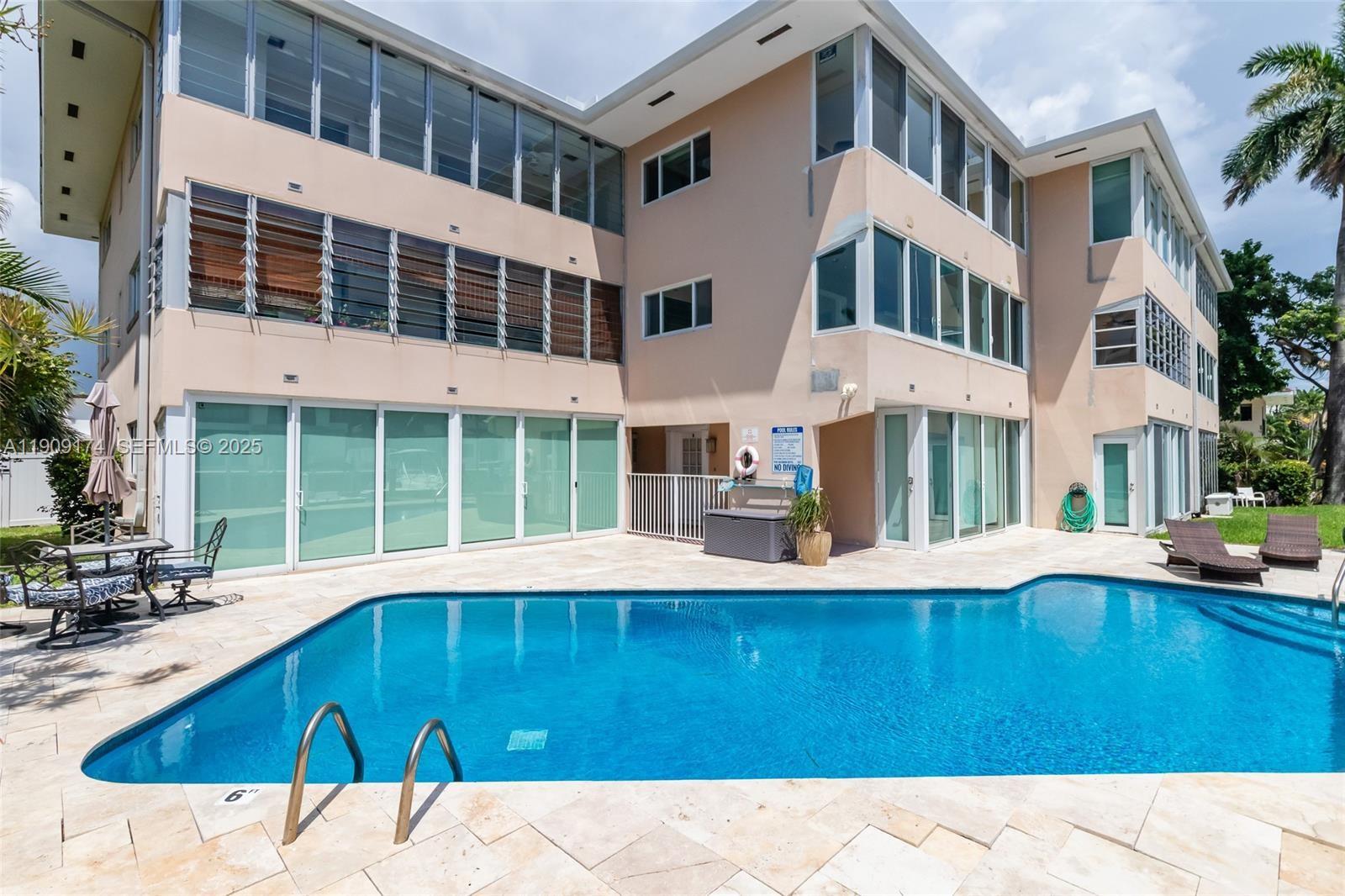 54 Isle Of Venice Drive, Unit 7 Fort Lauderdale, FL 33301 - Photo 33 of 41 a view of a building with a patio