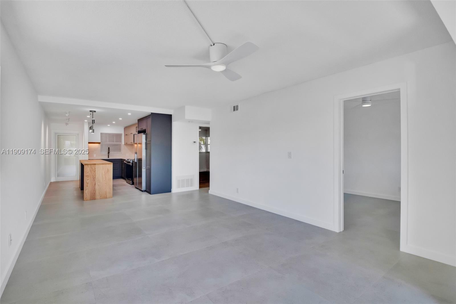 54 Isle Of Venice Drive, Unit 7 Fort Lauderdale, FL 33301 - Photo 10 of 41 a view of a kitchen with refrigerator and kitchen