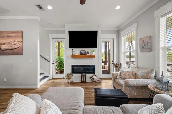 a living room with fireplace furniture and a flat screen tv