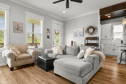 a living room with furniture and a large window