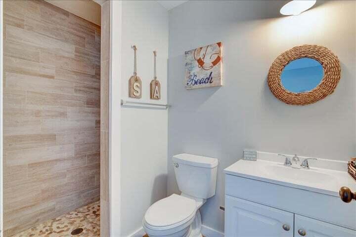 71 Childers Lane Freeport, FL 32439 - Photo 20 of 48 a bathroom with a toilet a sink and a mirror