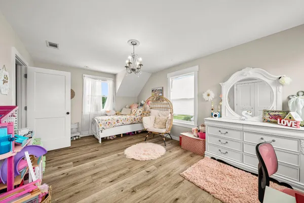 a living room with furniture chess table and furniture