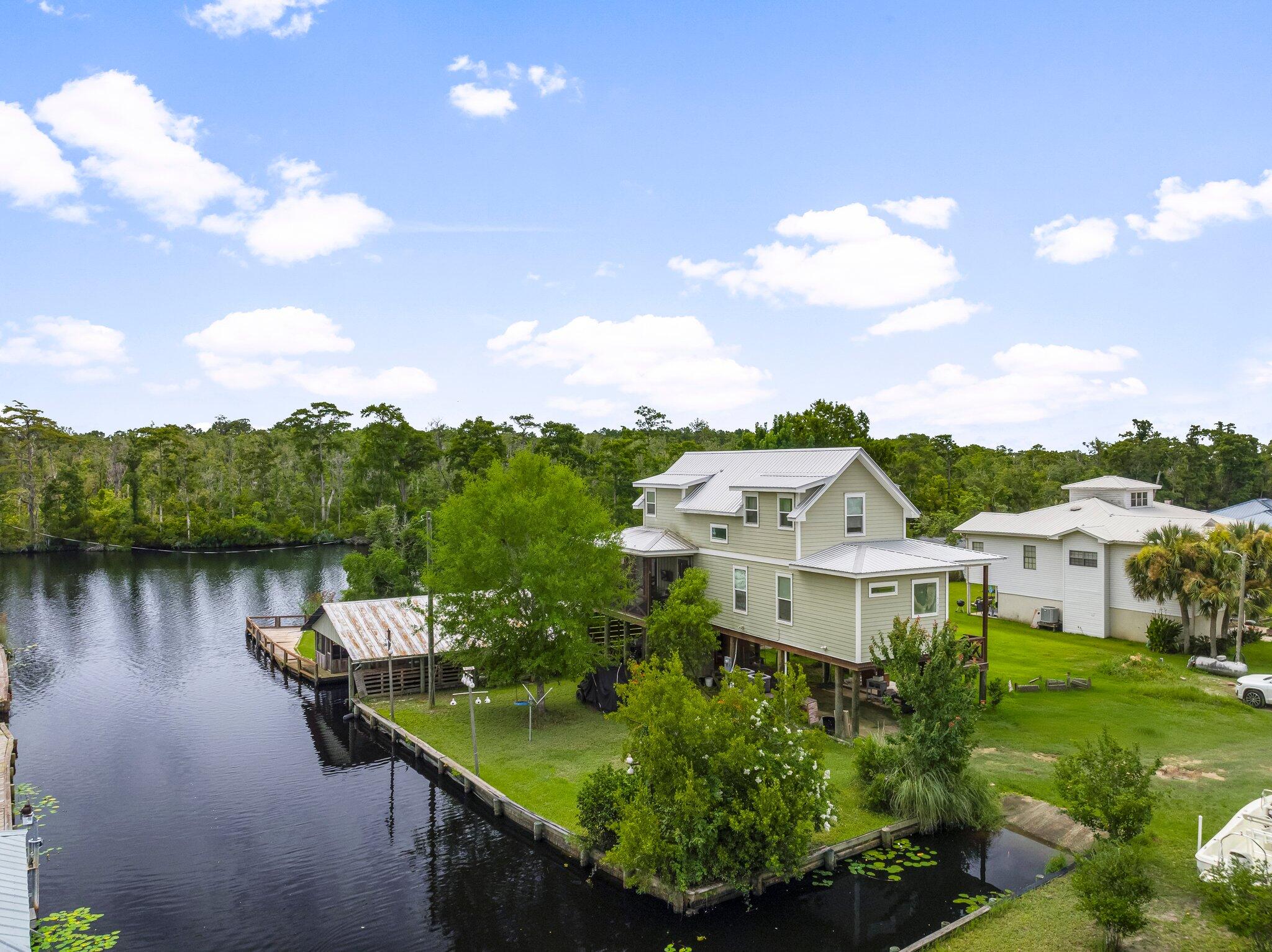 71 Childers Lane Freeport, FL 32439 - Photo 3 of 48 a view of a lake with houses