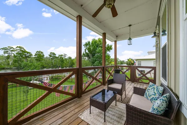 a view of a two chairs in the balcony