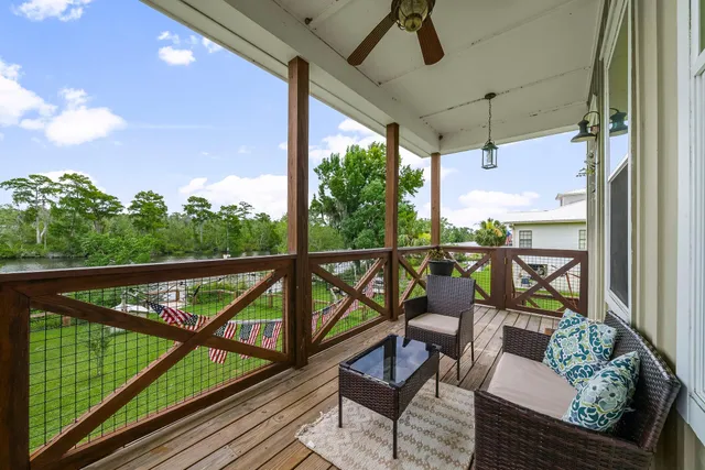 a view of a two chairs in the balcony