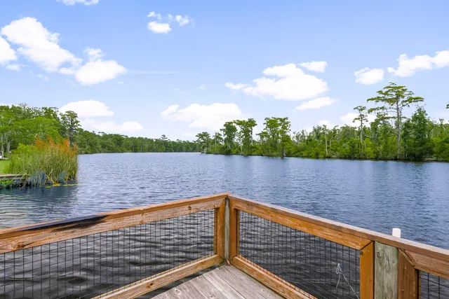 a view of a porch with furniture and a yard