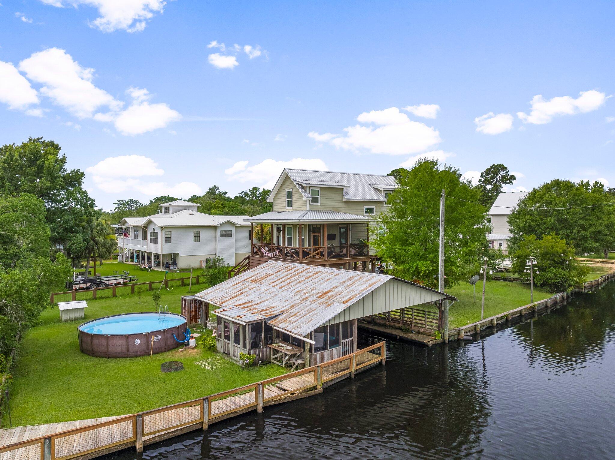 71 Childers Lane Freeport, FL 32439 - Photo 44 of 48 an aerial view of a house with swimming pool garden and patio