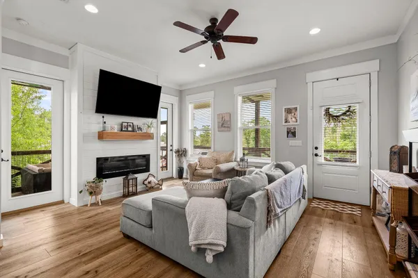 a living room with fireplace furniture and a flat screen tv