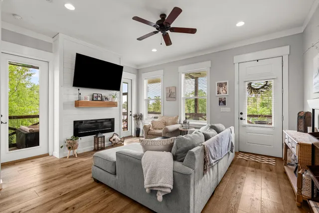 a living room with fireplace furniture and a flat screen tv