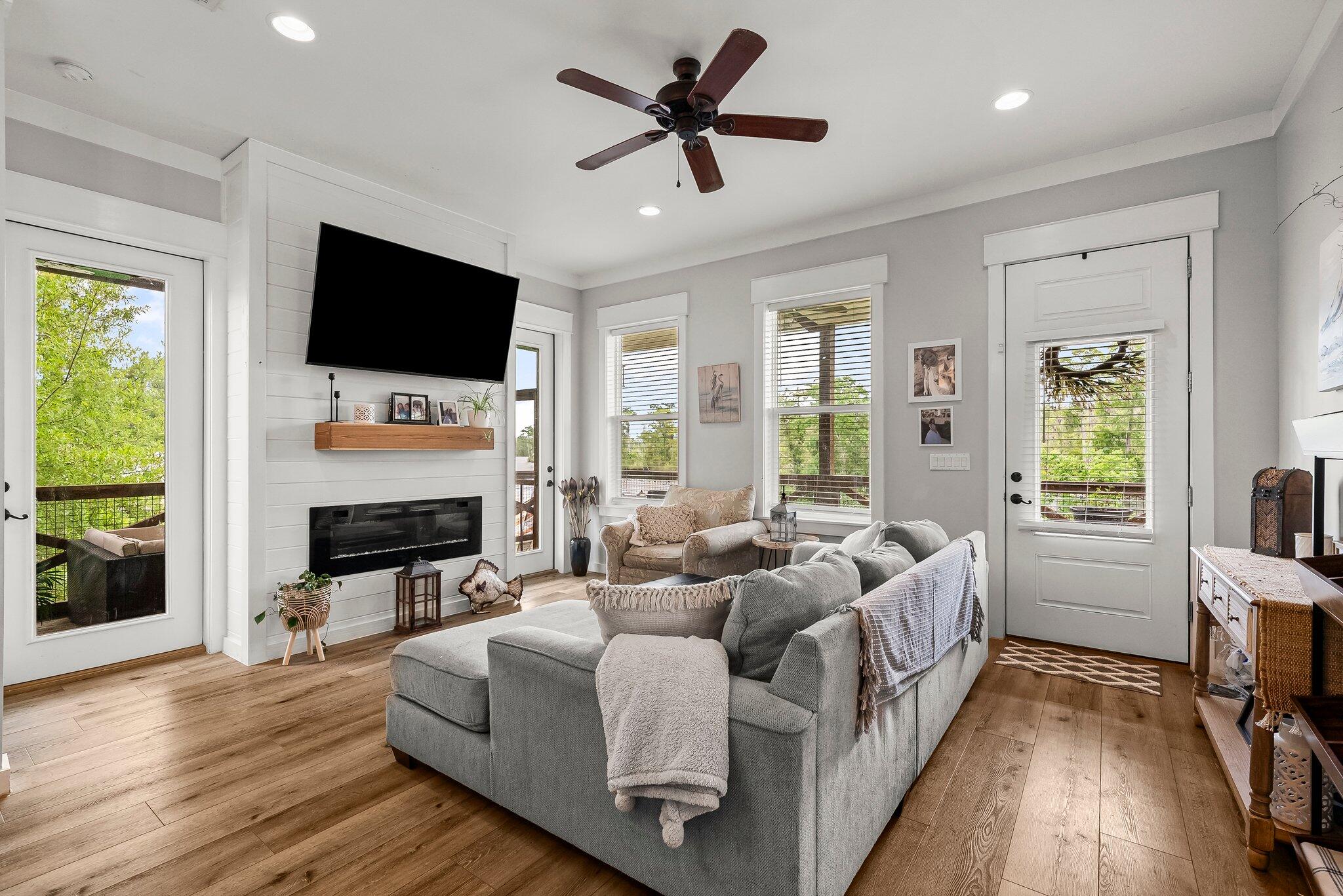 71 Childers Lane Freeport, FL 32439 - Photo 10 of 48 a living room with fireplace furniture and a flat screen tv
